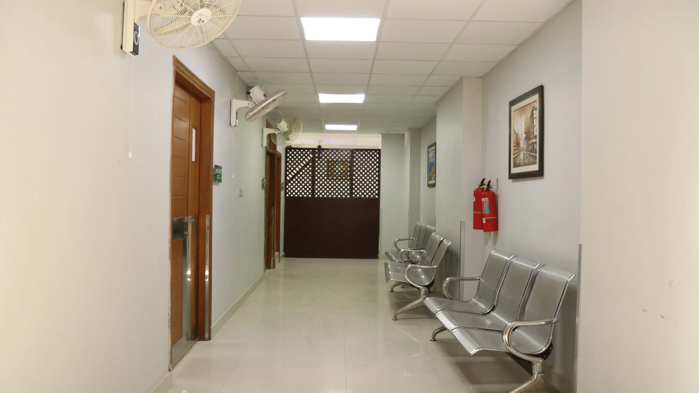 Outpatient corridor with waiting area at Hamdard University Hospital